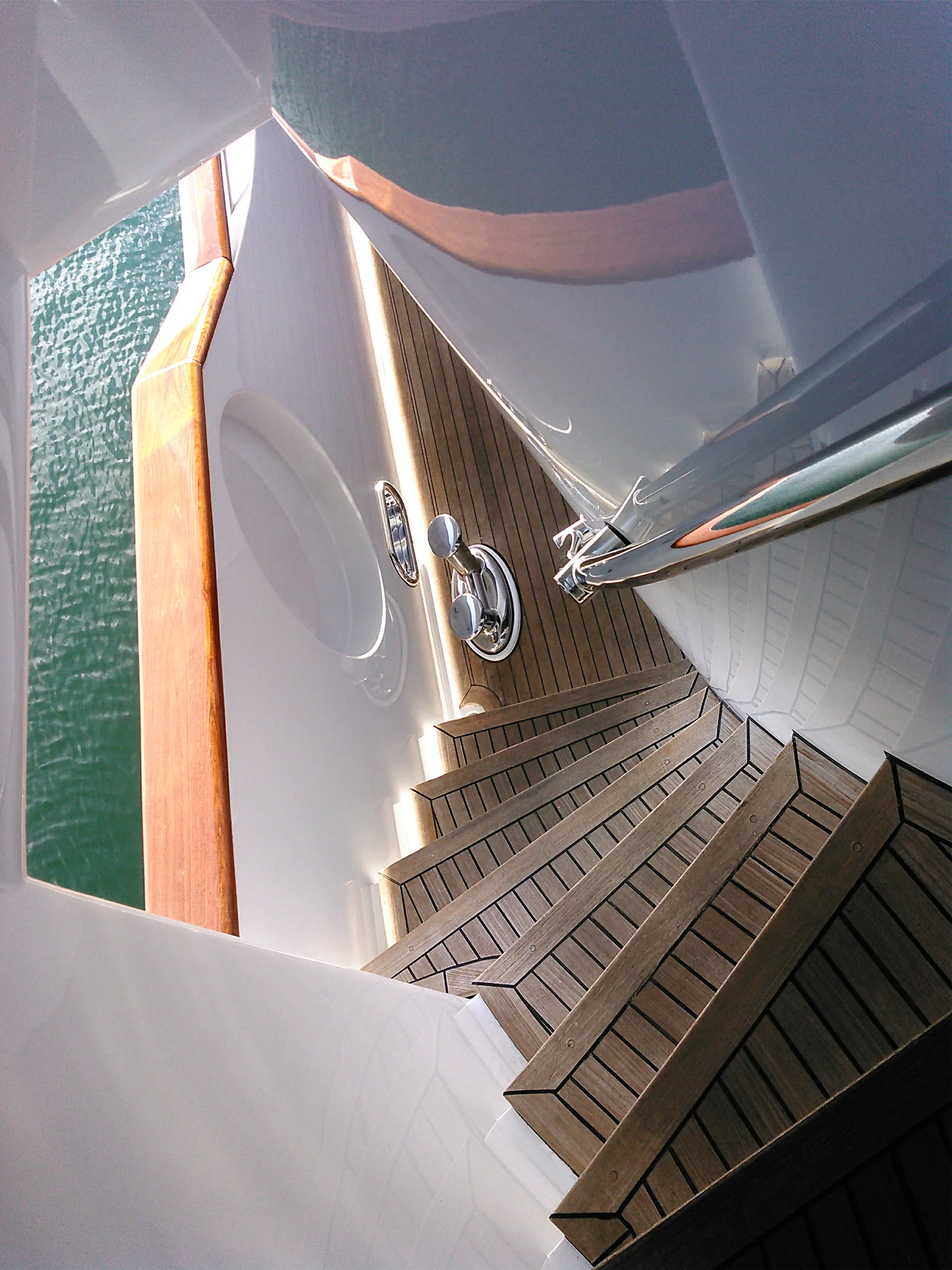 Teak stairs going down to the lower deck